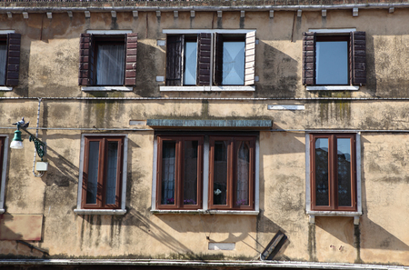 Old gungy wall with immured windowの写真素材