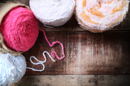 Colorful yarn balls on a wooden background room for copy space  vintage styleの写真素材