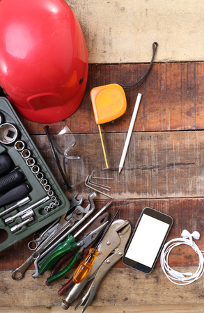 set of hand tools on a wooden tableの写真素材