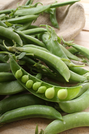 fresh beans broad over wood background, selective focusの写真素材