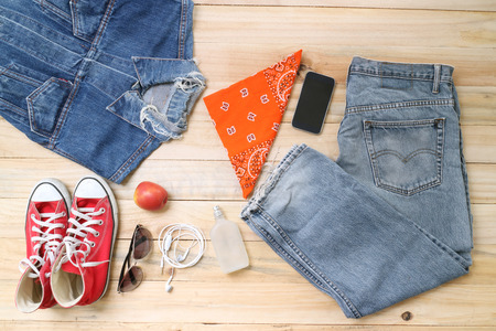 Outfit of traveler, student, teenager, young woman or guy. Overhead of essentials for modern young...