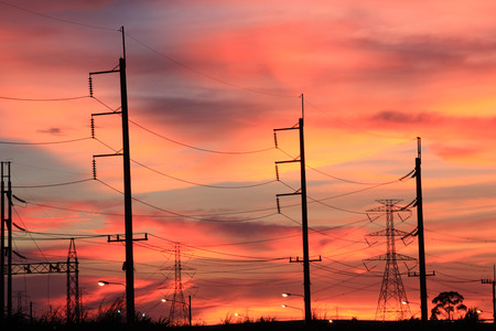 Impression network at transformer station in sunrise, high voltage up to full color sky take with...