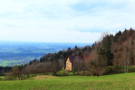Panoramic view of beautiful mountain landscape in the Bavarian Alps with village of Berchtesgaden and Watzmann massif in the background at sunrise, Nationalpark Berchtesgadener Land, Bavaria, Germanyの写真素材