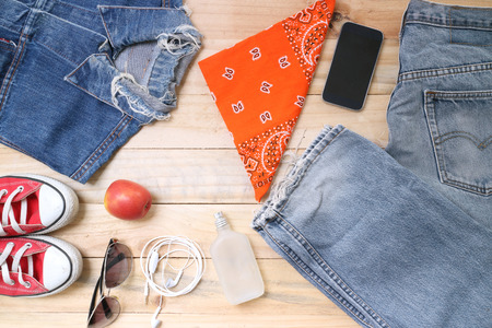 Outfit of traveler, student, teenager, young woman or guy. Overhead of essentials for modern young...