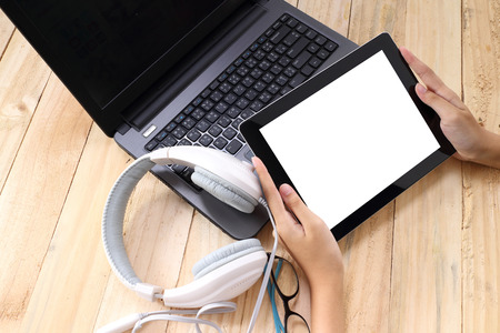 Creative professional's work items and tech gadgets from aboveの写真素材