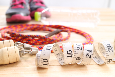 fitness equipment isolated on wood  backgroundの写真素材