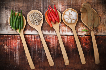 Spices and herbs in  wooden spoons.の写真素材