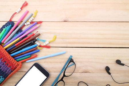 overhead of office table or student table with smartphone. copy spaceの写真素材