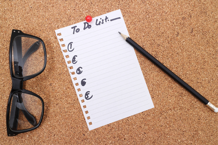 To Do List stuck to a noticeboard.の写真素材