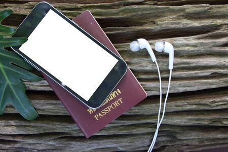 travel concept, Preparation for travel,  passport, road map on wooden tableの写真素材