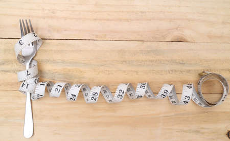 fork and measuring tape for a healthy lifestyleの写真素材