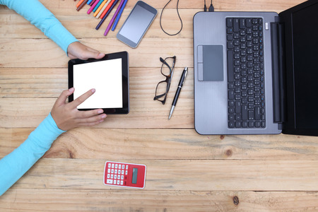 Top view of people working at old wooden table and working with laptops, smart-phones blank empty...