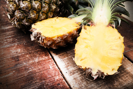 Pineapple fruit cut on woodenの写真素材