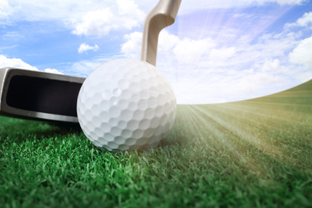 Playing golf. Golf club and ball. Preparing to shotの写真素材