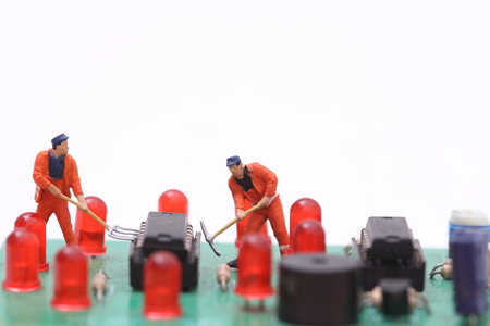 Miniature technician repairing computerの写真素材