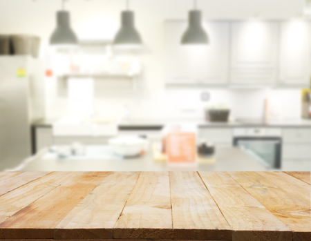 Empty wooden table and blurred kitchen background, productの写真素材