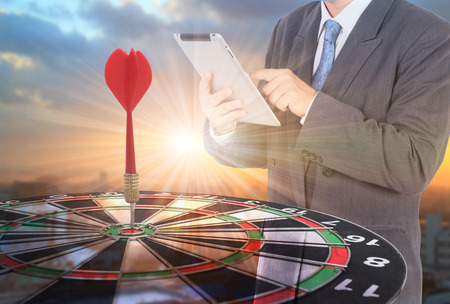 target dart with arrow with Double exposure of success businessman  ,metaphor to target marketing or...