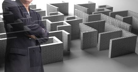 successful businessman standing near the entrance of labyrinthの写真素材