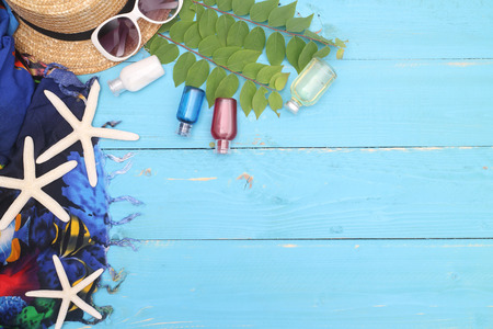 beach accessories on wooden board,travel concept