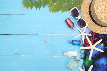 beach accessories on wooden board,travel concept
