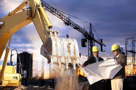 engineer looking construction worker in a building site over Blurred construction worker on...