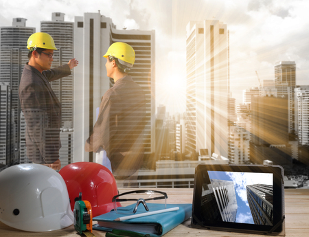 civil engineer stand on ground working in a land building site over Blurred construction worker on construction site. examination, inspection, surveyの写真素材