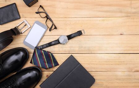 wood texture. Men's everyday objects on a dark background. business meeting. Accessories for the business of the day.の写真素材