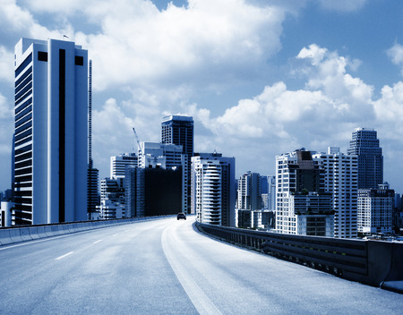 city road through modern buildings or modern office building background