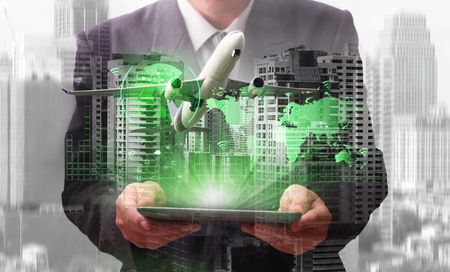  success businessman working  industry 4.0 with computer and green radar screen over world map of the  Logistic Import Export conceptの写真素材