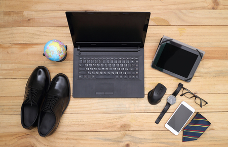 Wooden table with office supplies, top viewの写真素材