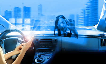 autopilot mode  ,  vehicle running self driving mode and a woman driverの写真素材