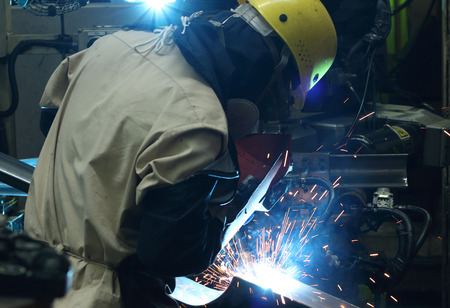  welding man  in the automotive parts industry