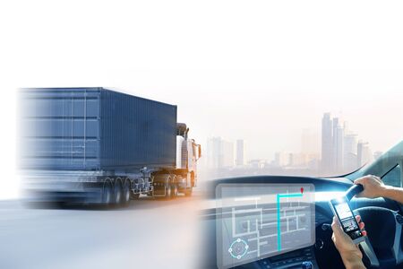 Truck run on road, Drive on road, transportation logistics concept,Businessman hold tablet or mobile phone working control logistics or import export industryの写真素材