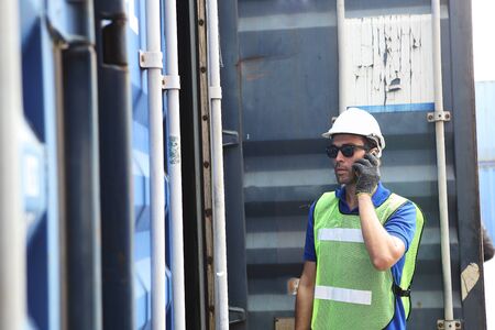 Worker inspecting cargo shipping containers. before departure.の写真素材