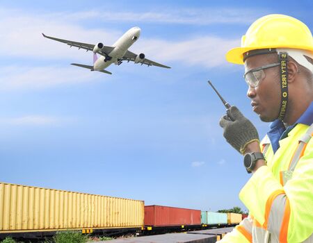 Close up of An African American handsome black engineer he is working in container box yard areaの写真素材