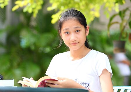 working from home effect from covid 19 virus 
she working at home in garden の写真素材