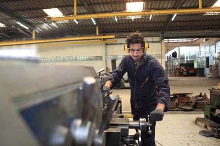 Male  Industrial Engineers with  machine. Assist production engineer in industry. He checking  control  plastic factory for car. Concept Successful of Work.の写真素材