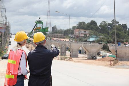 Engineer on site, they are working at building construction area.の写真素材