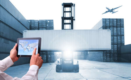 Double exposure of hand man with world map for logistic network distribution on background and Logistics Industrial Container Cargo freight ship for shipping and Transportation, import-exportの写真素材