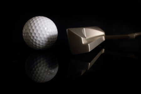Golf ball and golf club on dark Backgroundの写真素材