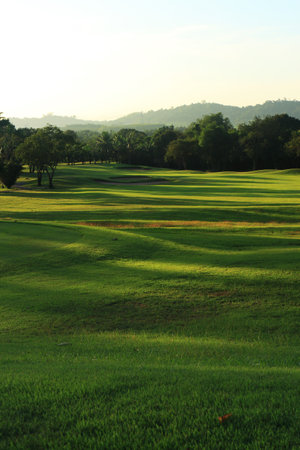 Beautiful golf course at the sunset, sunrise time.の写真素材