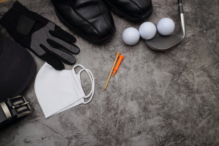 golf ball and accessories on floorの写真素材