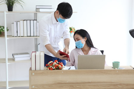 Covid-19 concept. People wearing mask for protect cough with Covid-19 virus outbreak , work from home , new normalの写真素材