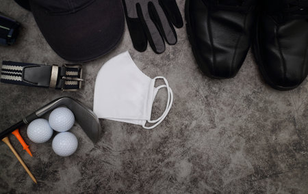 golf ball and accessories on floorの写真素材