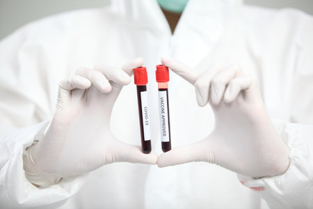 Laboratory research. Team work Scientists  study data and evaluating microscope success. they are doing research with dropper chemical testing life science and find vaccine for covid 19の写真素材