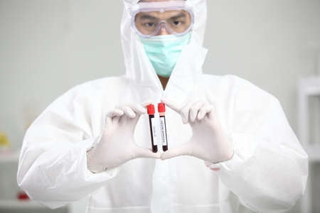 Laboratory research. Team work Scientists  study data and evaluating microscope success. they are...