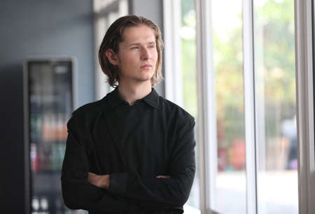A  Handsome male barista is working in coffee shopの写真素材