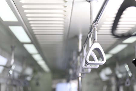 Hand held on the bus for hang to stability when crowed.Subway car pull ring.hand pull inside train ,...