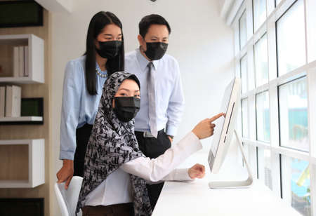 Asian Muslim female manager interviewing job applicant consulting male client at diverse group meeting negotiations, businesswoman  speaking to partner, human resource concept , business meetingの写真素材