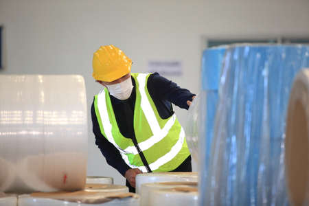 Team workers wear protective face masks for safety industrial factory. worker meeting before start...